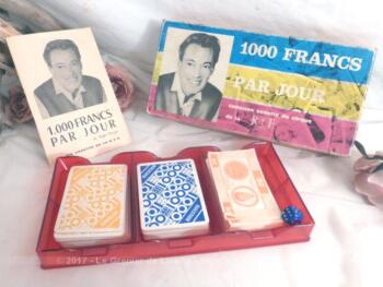 Ancienne boite de jeu des "1000 francs" de Roger Lanzac, avec cartes questions, cartes réponses, régles du jeu et dé. Début des années 60.