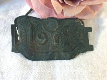 Ancienne vignette pour vélo en laiton pour l'année 1912.