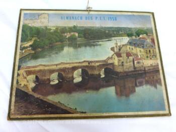 Almanach cartonné des PTT de 1958 sans feuillets. Il y a d'un coté une grande photo du "Vieux pont sur le Loch à Auray (Morbilhan) et de l'autre l'année complète.