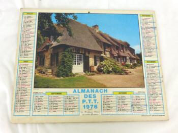 Ancien almanach des P.T.T. de 1976 avec la photo d'un champs de fleur avec la photo d'un Berger Allemand d'un coté et d'une chaumière de l'autre avec 10 pages supplémentaires.