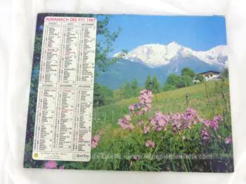 Ancien almanach des P.T.T. de 1987 avec d'un coté un village sous la neige et un alpage au printemps de l'autre avec 12 feuillets supplémentaires
