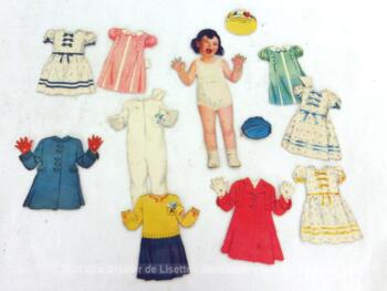 Voici une ancienne poupée découpée dans du papier avec toute sa garde-robe.