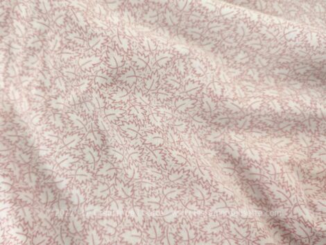 Voici un coupon de tissus housse de couette de 130 x 190 composé de 2 tissus, un positif et un négatif de dessins de feuilles dans les tons rose.