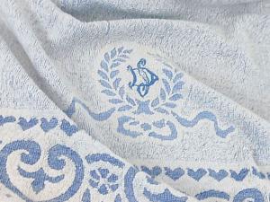 Ancienne serviette bleu pastel avec franges