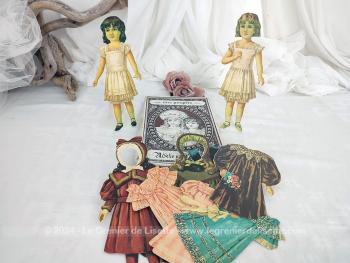 Voici une boite en carton du jeu "Mes Poupées Adèle et Mélanie"  avec à l'intérieur 2 poupées en cartons et leur garde robe, avec robes, manteaux et chapeaux. De 1984 et made in Germany.