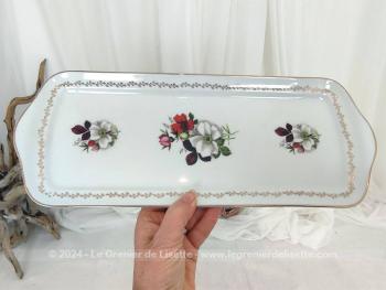 Datant des années 70/80, voici un beau plat à cake en porcelaine estampillé "Véritable Porcelaine Fine France", tendance shabby avec ses décors de fleurs et son guirlande dorée sur tout le pourtour.