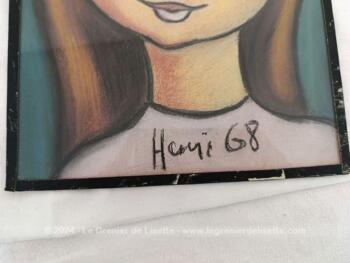 Voici un duo de portraits d'enfants réalisée en pastel, habillé d'une vitre et scellé sur un carton par de l'adhésif noir. Ces portraits au traits naïfs sont signés 
