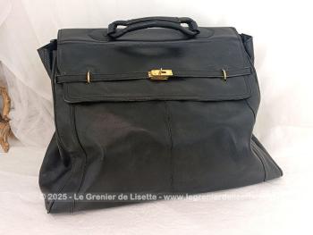 Voici un superbe grand sac de voyage en cuir noir avec une belle forme d'ancienne sacoche de docteur  avec toutes ses poches intérieures et ses 2 grandes ceintures pour fermer le sac.